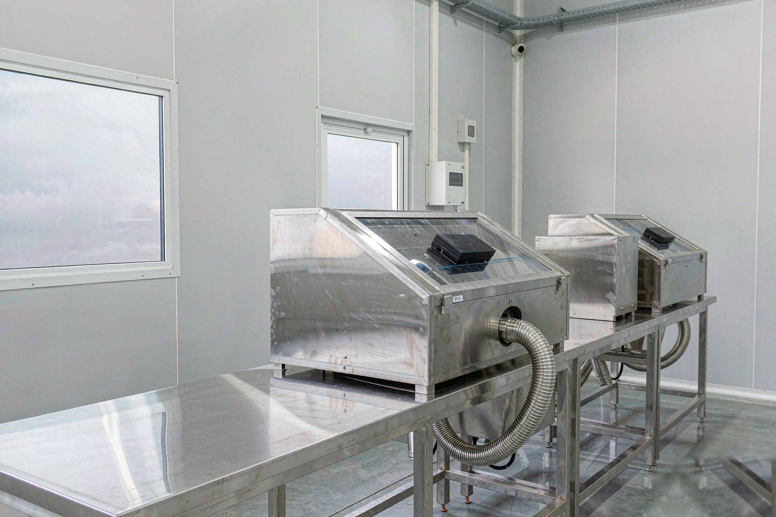 Clean manufacturing floor with production machinery in operation