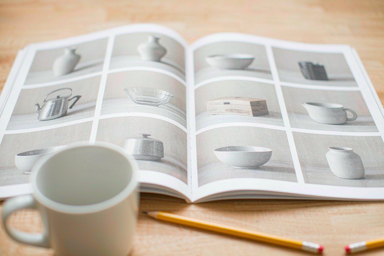 Trade catalogue open at a page of product photographs